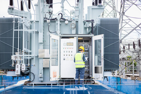 Man working on electrical panel